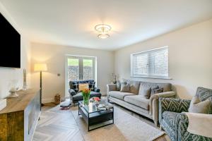 a living room with a couch and a table at 4 Bed in Holmfirth oc-s31134 in Holmfirth