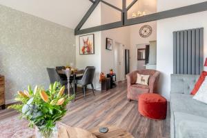 a living room with a couch and a table at 1 Bed in Hunmanby oc-w30527 in Hunmanby +21 photos
