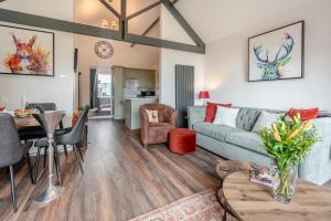 a living room with a couch and a table at 1 Bed in Hunmanby oc-w30527 in Hunmanby