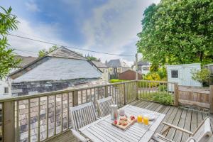 a patio with a table and chairs on a deck at 3 Bed in Egloshayle oc-m32201 in Egloshayle