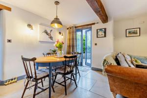 a kitchen and dining room with a table and chairs at 2 Bed in Pentre Bach oc-b30875 in Pentre-bâch