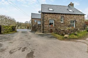 an image of a stone house with a driveway at 2 Bed in Pentre Bach oc-b30875 in Pentre-bâch