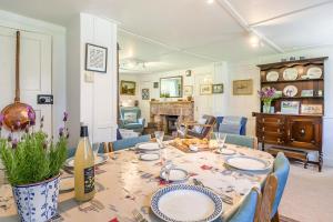 a dining room with a table with plates on it at 2 Bed in Stalham oc-u32571 in Stalham