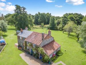 an aerial view of a house in a field at 2 Bed in Stalham oc-u32571 in Stalham