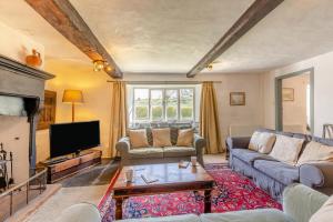 a living room with a couch and a tv at 3 Bed in Windermere oc-b31667 in Crook