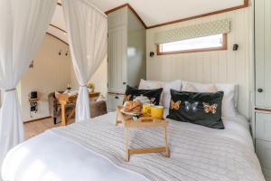 a bedroom with a large white bed with a table at 1 Bed in Brecon oc-t31948 in Bronllys