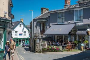 a group of people walking down a street at 1 Bed in Brecon oc-t31948 in Bronllys