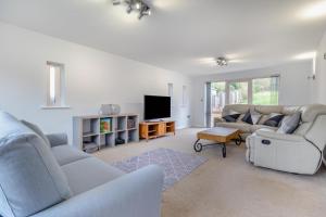 a living room with two couches and a tv at 4 Bed in Caistor oc-t30831 in Caistor
