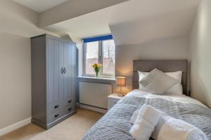 a bedroom with a bed and a window at 4 Bed in Caistor oc-t30831 in Caistor