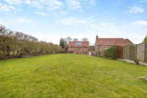 an empty field in front of a house at 4 Bed in Caistor oc-t30831 in Caistor