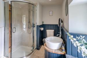 a bathroom with a sink and a shower at 6 Bed in Llanwern oc-w31947 in Brecon +57 photos
