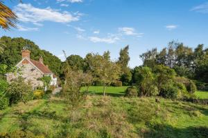 an old house in the middle of a field at 4 Bed in Arne oc-wy343 in Arne