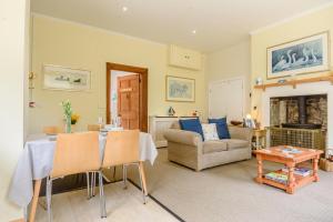 a living room with a table and a couch at 1 Bed in Sizewell oc-gdnf in Sizewell