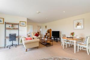 a living room with a couch and a table at 1 Bed in Flore oc-b32437 in Flore