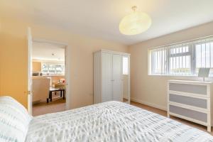 a bedroom with a white bed and a window at 1 Bed in Flore oc-b32437 in Flore