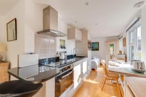 a kitchen with a counter and a dining room at 1 Bed in Waldringfield oc-thstu in Waldringfield