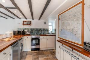a kitchen with a large map on the wall at 2 Bed in Chideock oc-g32451 in Chideock