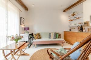 a living room with a couch and a table at 1 Bed in Luddenham oc-s32602 in Luddenham +12 photos