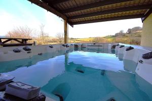 a large pool of blue water in a building at 5 Bed in Devils Bridge oc-t13712 in Devils Bridge