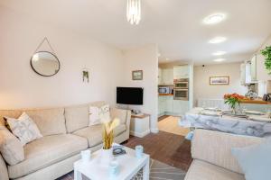 a living room with a couch and a table at 2 Bed in Aspatria oc-p32645 in Aspatria