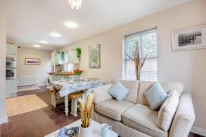 a living room with a couch and a table at 2 Bed in Aspatria oc-p32645 in Aspatria