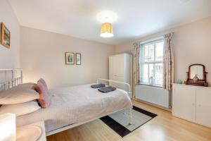 a bedroom with a bed and a window at 2 Bed in Aspatria oc-p32645 in Aspatria