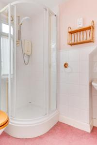 a bathroom with a shower and a toilet at 3 Bed in Littlestone oc-bt009 in New Romney +9 photos
