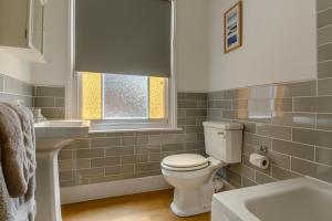 a bathroom with a toilet and a sink at 2 Bed in Southwold oc-hdoubl in Southwold +14 photos