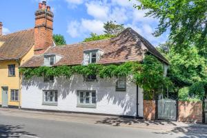 an old white house with ivy growing on it at 2 Bed in Dedham oc-c32543 in Dedham