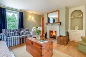 a living room with a couch and a fireplace at 3 Bed in Bungay oc-taf in Bungay