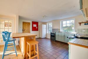 a kitchen with a table and a counter top at 3 Bed in Bungay oc-taf in Bungay +27 photos