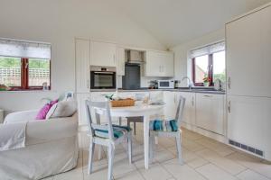 a kitchen and living room with a table and chairs at 1 Bed in Rolvenden oc-tn612 in Rolvenden