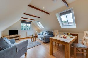 a living room with a couch and a table at 1 Bed in Rhodes Minnis oc-ct041 in Lyminge