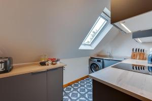 a kitchen with a sink and a stove at 1 Bed in Rhodes Minnis oc-ct041 in Lyminge