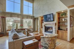 a living room with a couch and a fireplace at Elkhorn Lodge, A Vail Resorts Property in Avon
