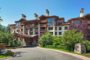 a large apartment building with a road in front of it at Elkhorn Lodge, A Vail Resorts Property in Avon