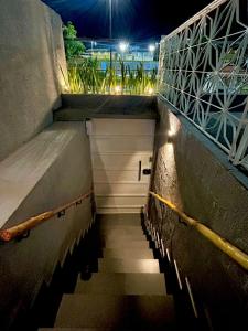 a stairway with a view of a city at night at Vibe Amazon in Manaus
