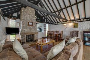 a living room with a couch and a table at 3 Bed in Bacton oc-711 in Bacton