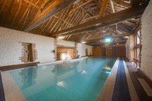 a large swimming pool in a building with a large at 3 Bed in Bacton oc-711 in Bacton