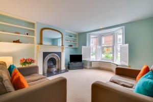a living room with two couches and a fireplace at 2 Bed in Walberswick oc-hhock in Walberswick