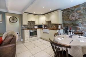 a kitchen with a table and a dining room at 2 Bed in Pwllheli oc-30aber in Pwllheli