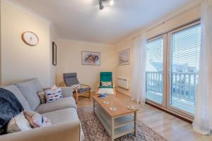 a living room with a couch and a table at 3 Bed in Broad Haven oc-t30529 in Broad Haven
