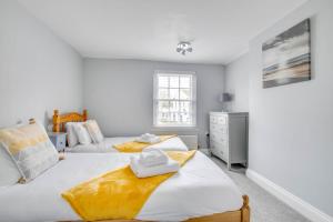 a bedroom with two beds and a dresser at 2 Bed in Southwold oc-eastgn in Southwold