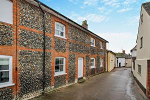an empty alley in an old brick building at 2 Bed in Lavenham oc-f30054 in Lavenham