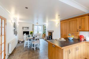 a kitchen with a table and a dining room at 3 Bed in Wooler oc-m31820 in Wooler
