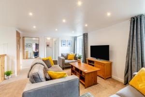 a living room with a couch and a television at 3 Bed in Wooler oc-m31820 in Wooler