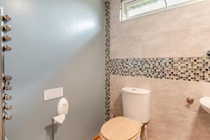 a bathroom with a toilet and a sink at 2 Bed in Keddington oc-t32411 in Louth +18 photos