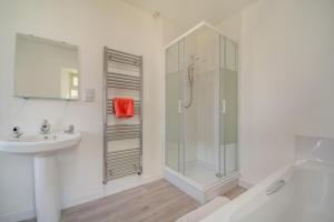 a white bathroom with a shower and a sink at 3 Bed in Clachan oc-h32242 in Clachan +14 photos
