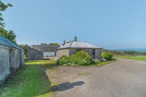 an empty road with two houses in the distance at 3 Bed in Clachan oc-h32242 in Clachan