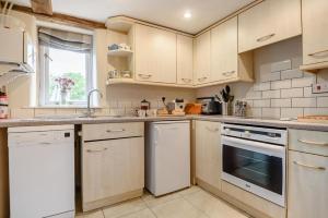 a kitchen with white appliances and a window at 2 Bed in Rumburgh oc-dgf in Rumburgh